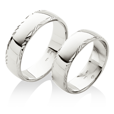 Široké snubní prsteny s jemnou ruční rytinou v platině