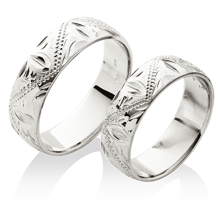 Široké snubní prsteny bohatě zdobené ruční rytinou z platiny
