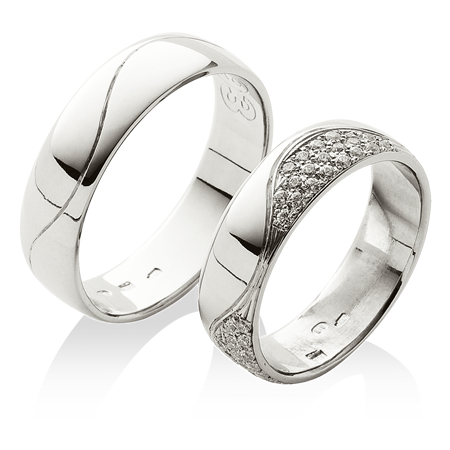 Široké prsteny s dámským bohatě osázeným kameny v platině
